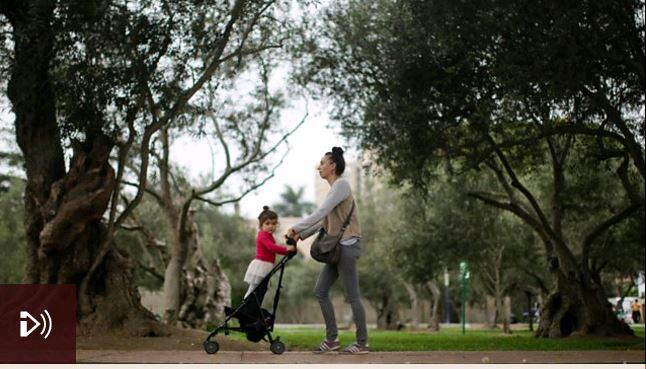 Image: A woman pushes a child in a pram, Credit: Getty Images